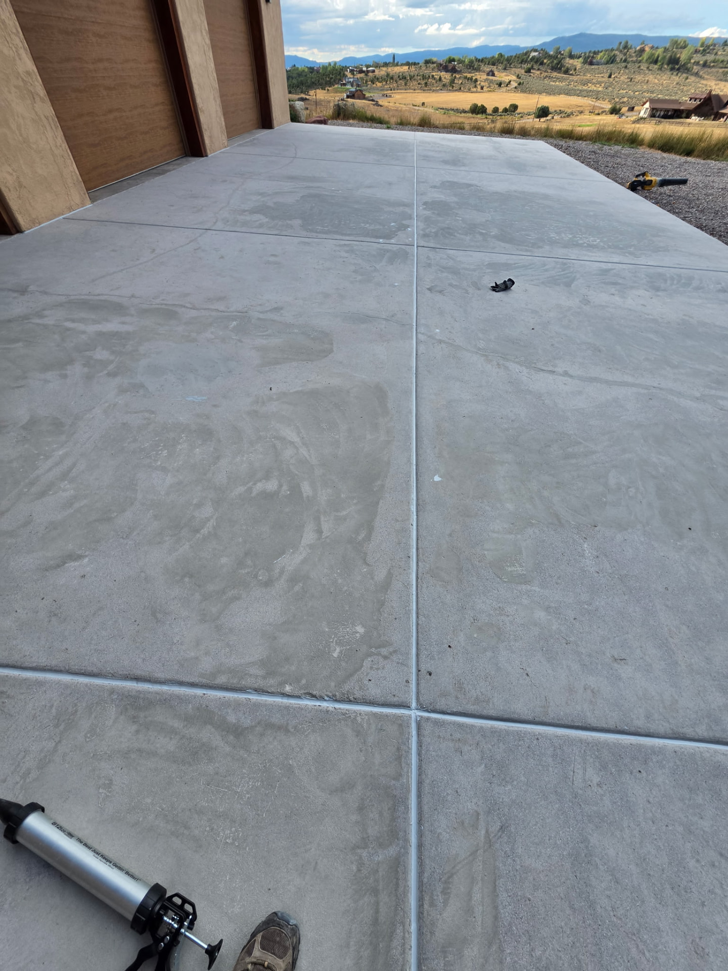 Freshly sealed concrete patio overlooking the Colorado mountains